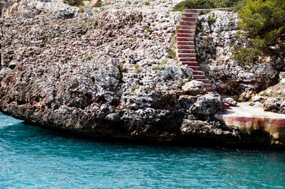 High angle view of rock in sea