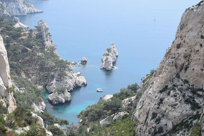 High angle view of rocks by sea