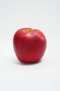 Close-up of apple against white background