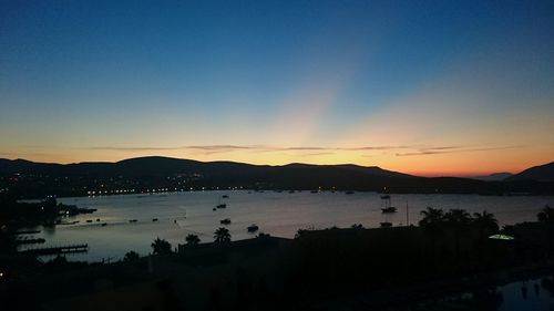 Scenic view of sea against sky at dusk