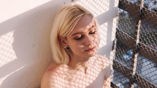 Portrait of young woman looking at camera