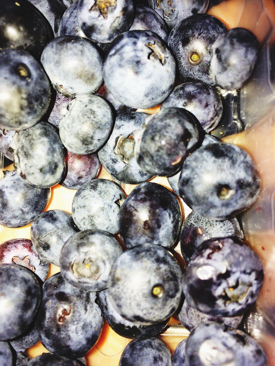 food and drink, healthy eating, fruit, large group of objects, food, abundance, freshness, close-up, market, full frame, animal themes, backgrounds, black color, market stall, blueberry, retail, high angle view, indoors, for sale