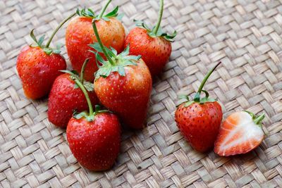 High angle view of strawberries on wicker