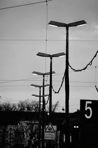 Low angle view of sign board against sky