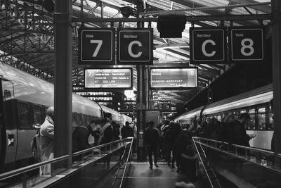 Group of people walking on illuminated city