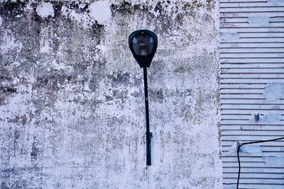 Close-up of street light on wall