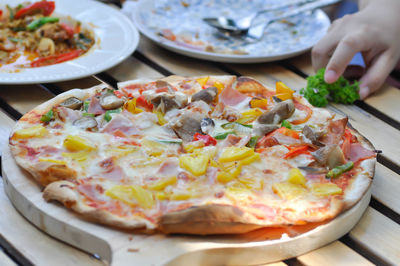 Close-up of pizza served on table