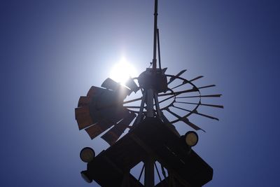 Low angle view of silhouette tower against clear sky