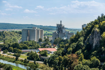 High angle view of trees and buildings against sky