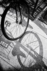 Shadow of bicycle on footpath