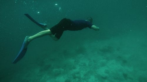 Man swimming in sea