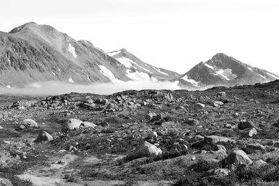 Scenic view of snowcapped mountains against clear sky