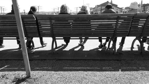 People sitting on terrace against sky