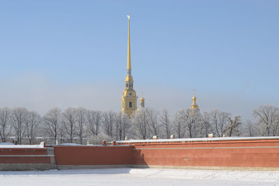 Snow covered building against sky