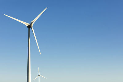 Wind turbine against sky