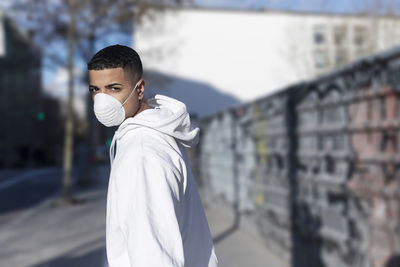 Portrait of young man standing outdoors