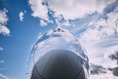 Low angle view of airplane against sky