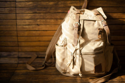 Close-up of bag on bench