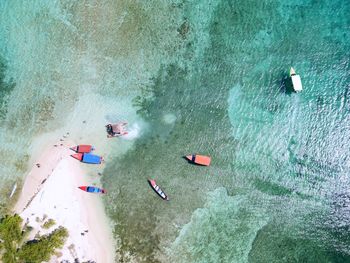 High angle view of people swimming in sea