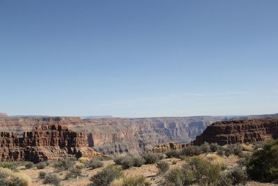 Scenic view of landscape against blue sky