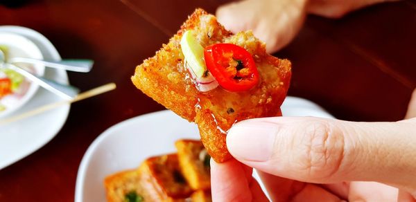 Close-up of person holding food