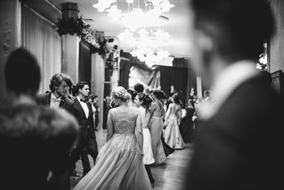 Group of people walking in corridor