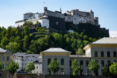 Low angle view of historical castle hohensalzburg against sky