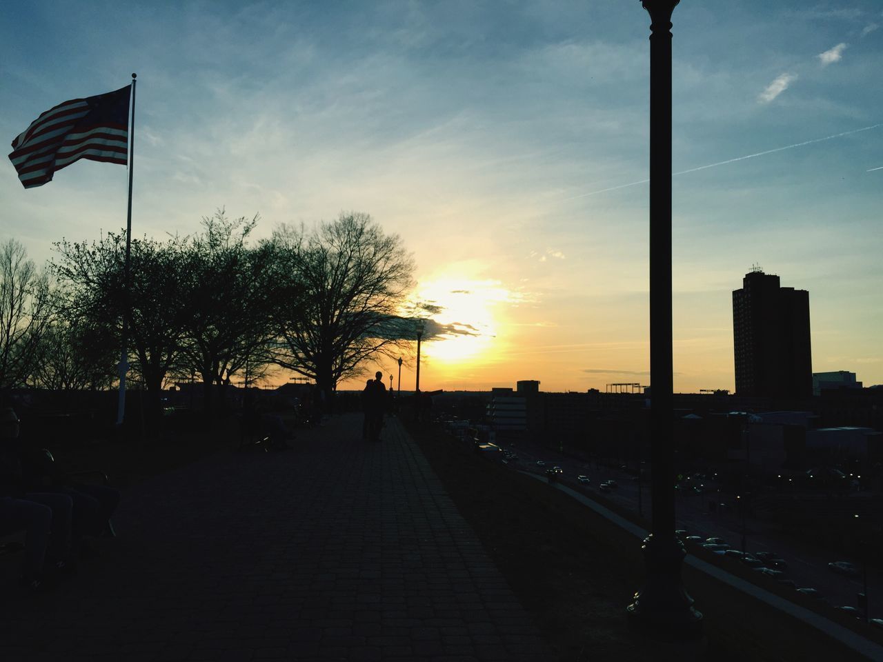 FLAG AGAINST SKY DURING SUNSET