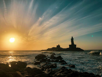 Scenic view of sea against sky during sunrise 