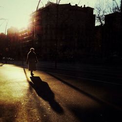 Woman walking on city street