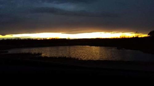 Scenic view of sunset over lake