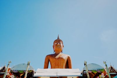 Low angle view of statue against sky