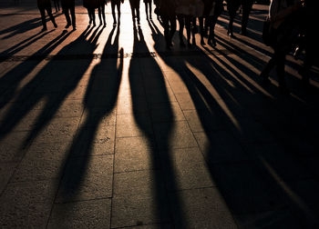 Low section of people walking on footpath