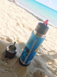 High angle view of bottle on beach