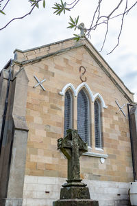 Low angle view of bell tower against sky