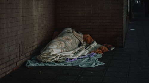 Man sleeping on wall