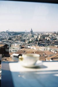 High angle view of buildings in city against clear sky