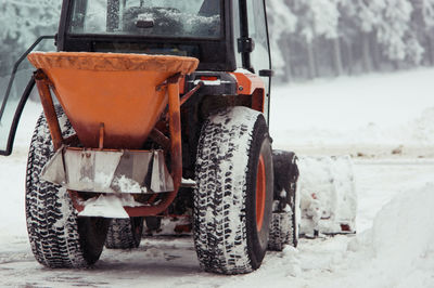 Close-up of earth mover on snow