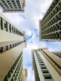 Low angle view of modern buildings against sky