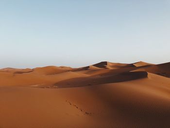 Scenic view of desert against clear sky