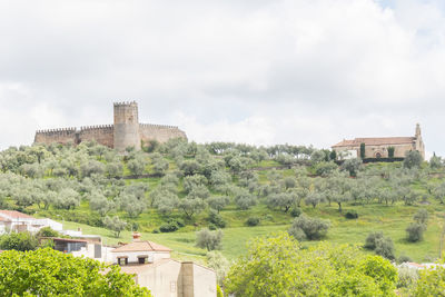 Buildings in city against sky