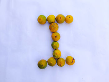 High angle view of oranges against white background