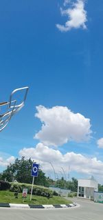 Low angle view of basketball hoop against blue sky