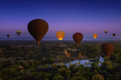 Sunset many hot air balloon with stupas in bagan, myanmar. bagan is an ancient with many pagoda.