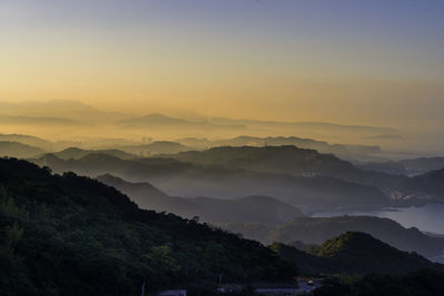 Scenic view of mountains against sky during sunset