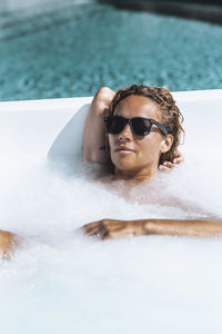 Portrait of woman swimming in pool