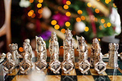 Close-up of chess pieces on table