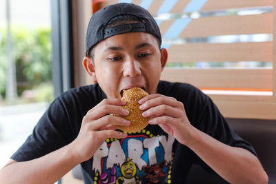 Portrait of boy eating food