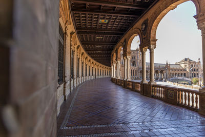 Bridge over canal amidst buildings in city