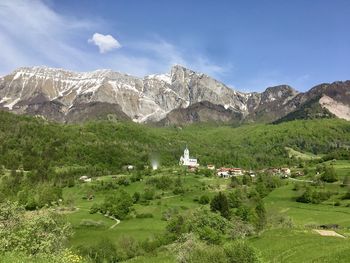 Scenic view of landscape and mountains against sky